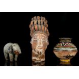 THREE WEST AFRICAN ARTEFACTS Including a funerary female terracotta head with high openwork coiffure