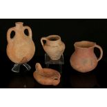 FOUR ANCIENT TERRACOTTA VESSELS Bronze Age to Roman Period, circa 3200 B.C. to 4th Century A.D.