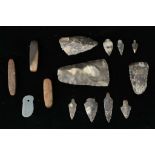 A GROUP OF FLINT TOOLS Including three replica scrapers and seven arrowheads, 3cm-10cm long,