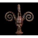 AN EKOI JANUS DANCE HEAD CREST 'EJAGHAM', NIGERIA Covered in leather surmounted by four spiral