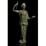 A ROMAN BRONZE FIGURE OF HERA Circa 2nd Century A.D. The goddess depicted wearing a long chiton