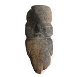 A GUERRERO STONE IDOL, MEXICO Of stylised shape, the limbs marked by notches, with high forehead,