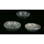 THREE EGYPTIAN GNEISS AND DIORITE BOWLS Early Dynastic Period, circa 3100-2686 B.C. With flat base