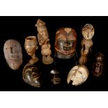 A GROUP OF AFRICAN ARTEFACTS Including a Makonde helmet mask, a Chokwe mask, a small Songye janiform