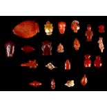 TWENTY-ONE EGYPTIAN CARNELIAN AND RED JASPER AMULETS AND PENDANTS New Kingdom to Late Period,