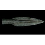 A EUROPEAN BRONZE SPEARHEAD Late Bronze Age, circa 8th-7th Century B.C. Leaf-shaped, with raised