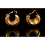 A PAIR OF ANCIENT NEAR EASTERN GOLD EARRINGS Circa 1st Millennium B.C. Hollow-cast, boat-shaped,