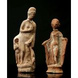 TWO ROMAN TERRACOTTA FIGURES OF APHRODITE Circa 1st-2nd Century A.D. One depicted nude bringing