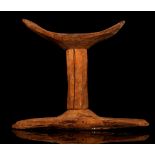 AN EGYPTIAN WOOD HEADREST New Kingdom, circa 1550-1070 B.C. Formed of three sections, the central