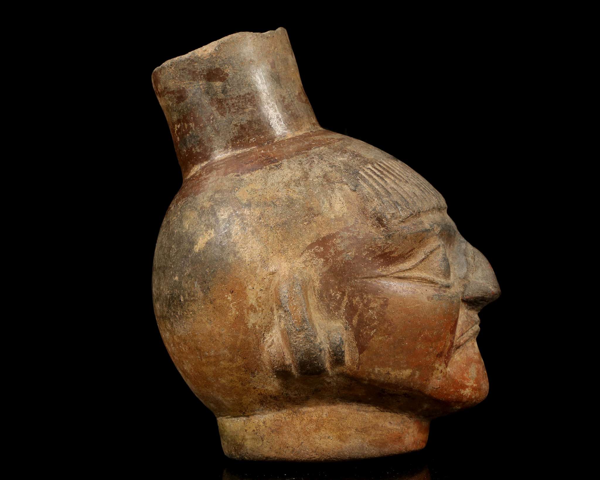 A MOCHE HEAD VESSEL, PERU Depicting the head of a man, possibly a priest, with a short fringe over - Image 5 of 5
