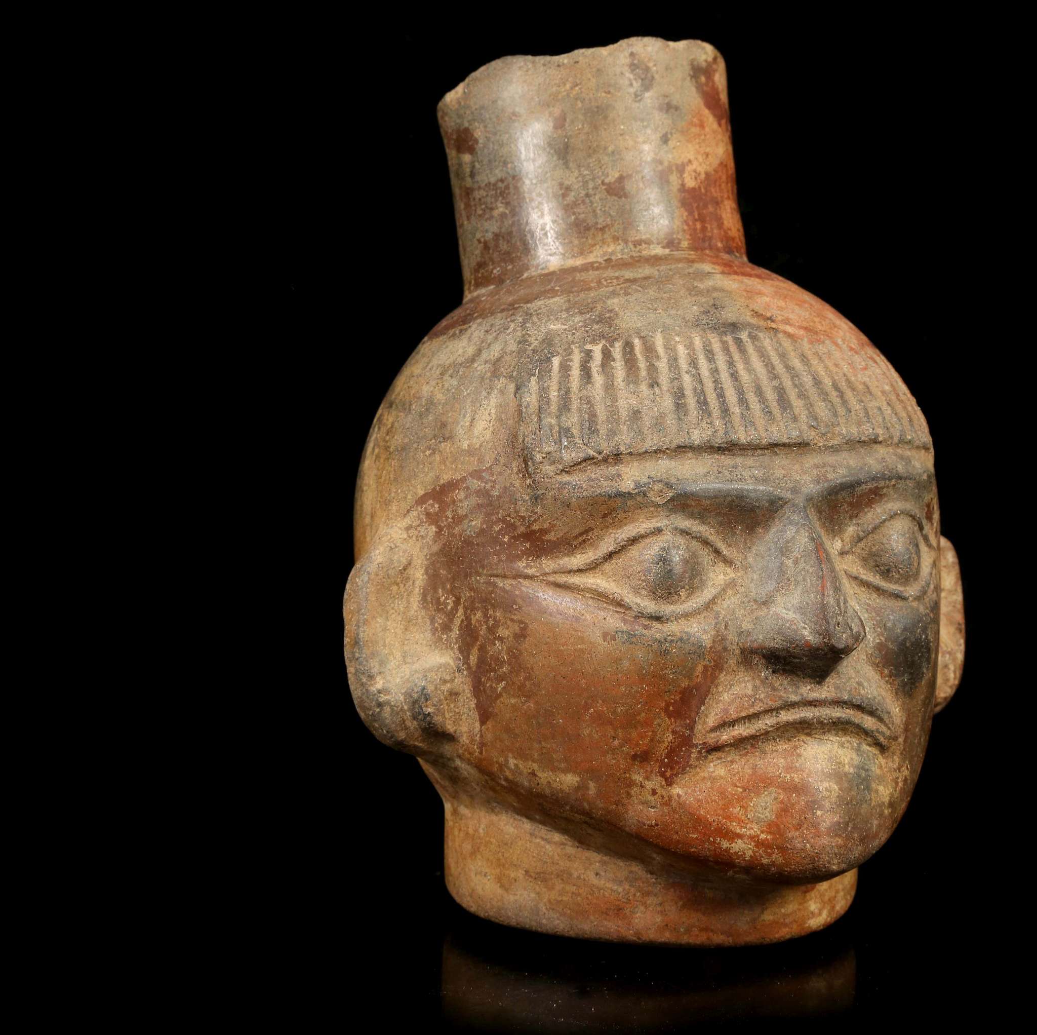 A MOCHE HEAD VESSEL, PERU Depicting the head of a man, possibly a priest, with a short fringe over - Image 2 of 5