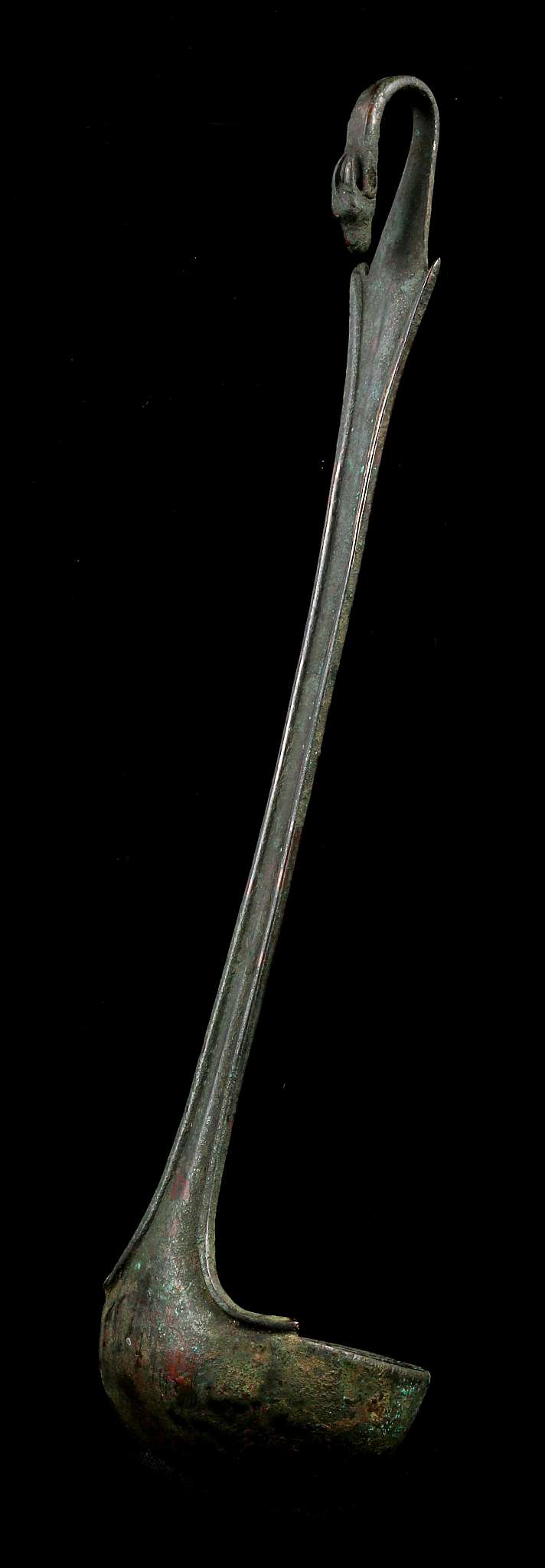 A ROMAN BRONZE LADLE Circa 1st-2nd Century A.D. With shallow bowl, the handle terminating in a