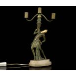 AN ART DECO PERIOD SPELTER FIGURAL THREE LIGHT LAM