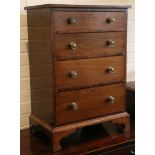 A very small mahogany chest of four long drawers o