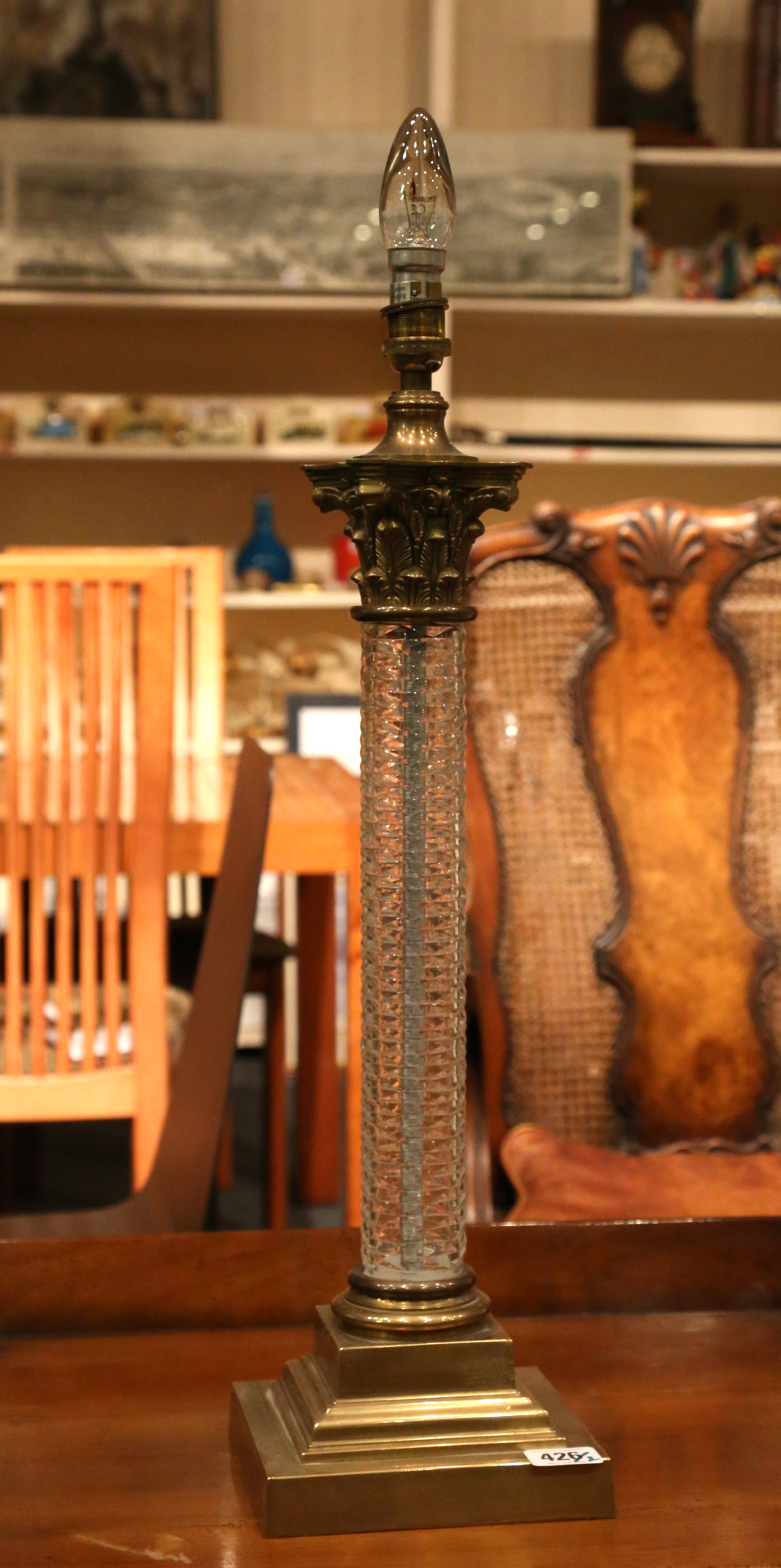 A pair of table lamps, brass leaf decorated capita