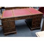 An early 20th century, mahogany pedestal desk encl