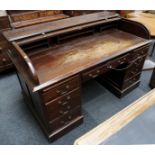 An early 20th century, mahogany tambour top desk,