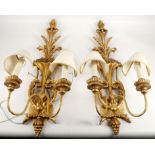 A pair of twin arm girondel wall lights, leaf in t