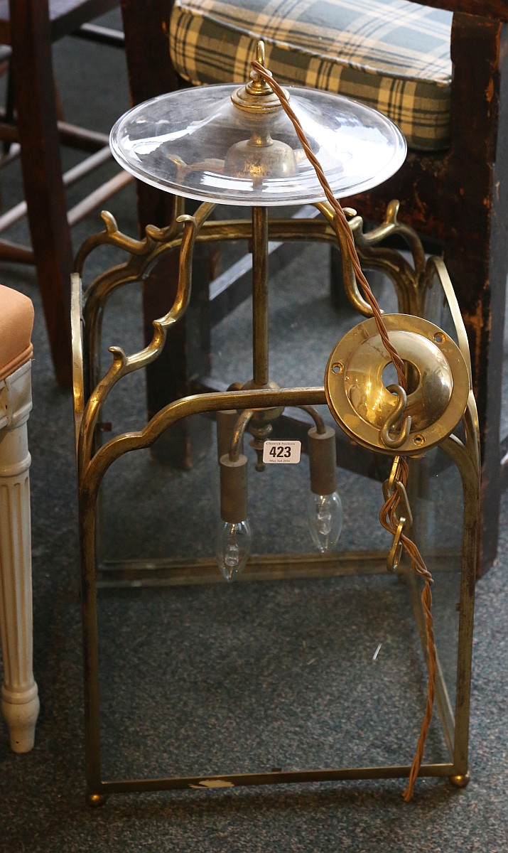 A brass four glass, hanging hall lantern in Georgi