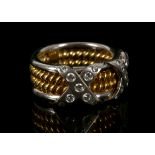 An 18ct gold and diamond set ring, with rose twist