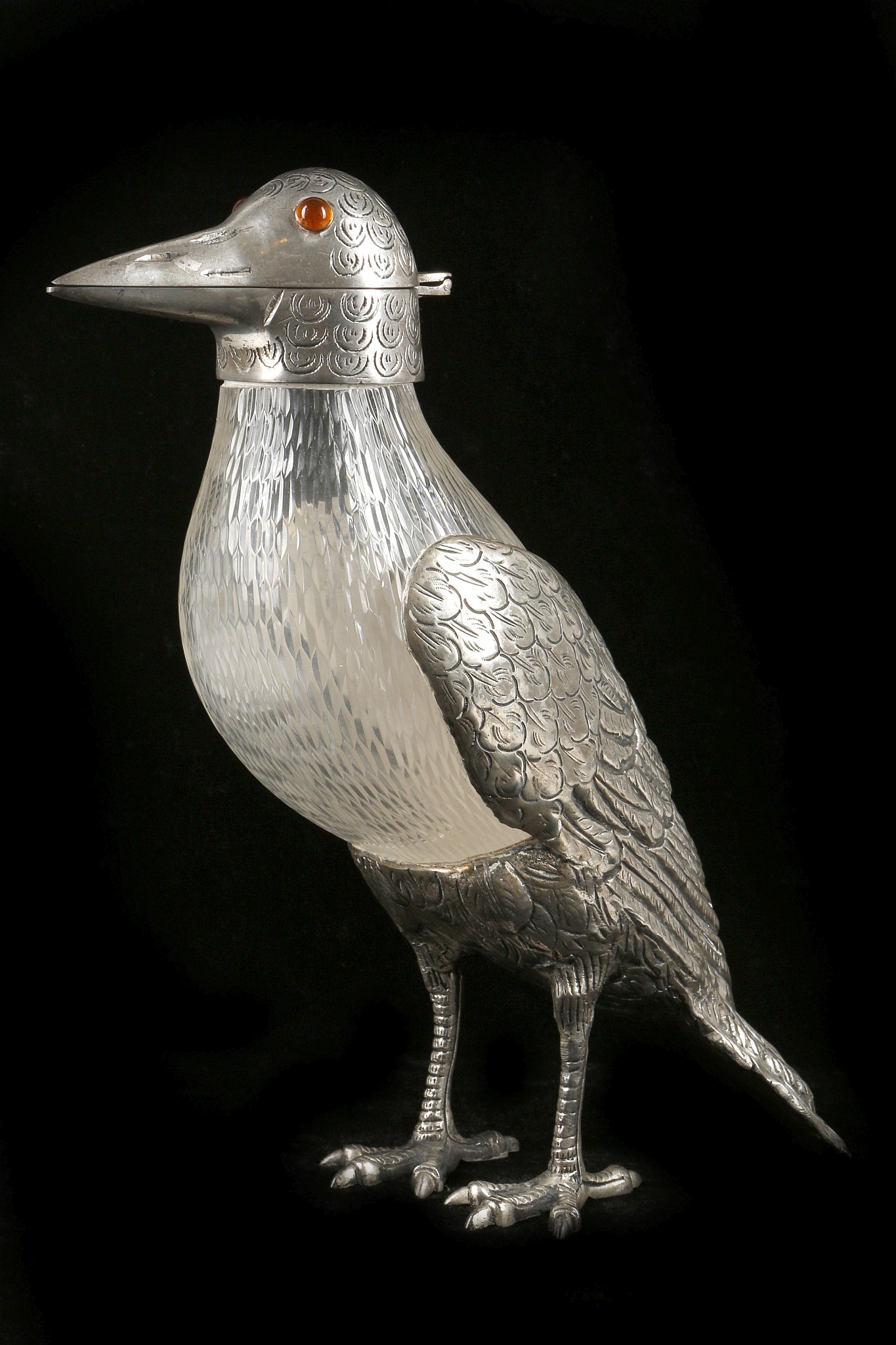 A claret jug, in the form of a Persian style bird,