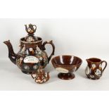 A Bargeware treacle glaze oversize teapot with teapot finial applied pheasant, thistle, floral