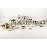A miscellaneous selection of pewter and silver plated items to include napkin rings, serving spoons,