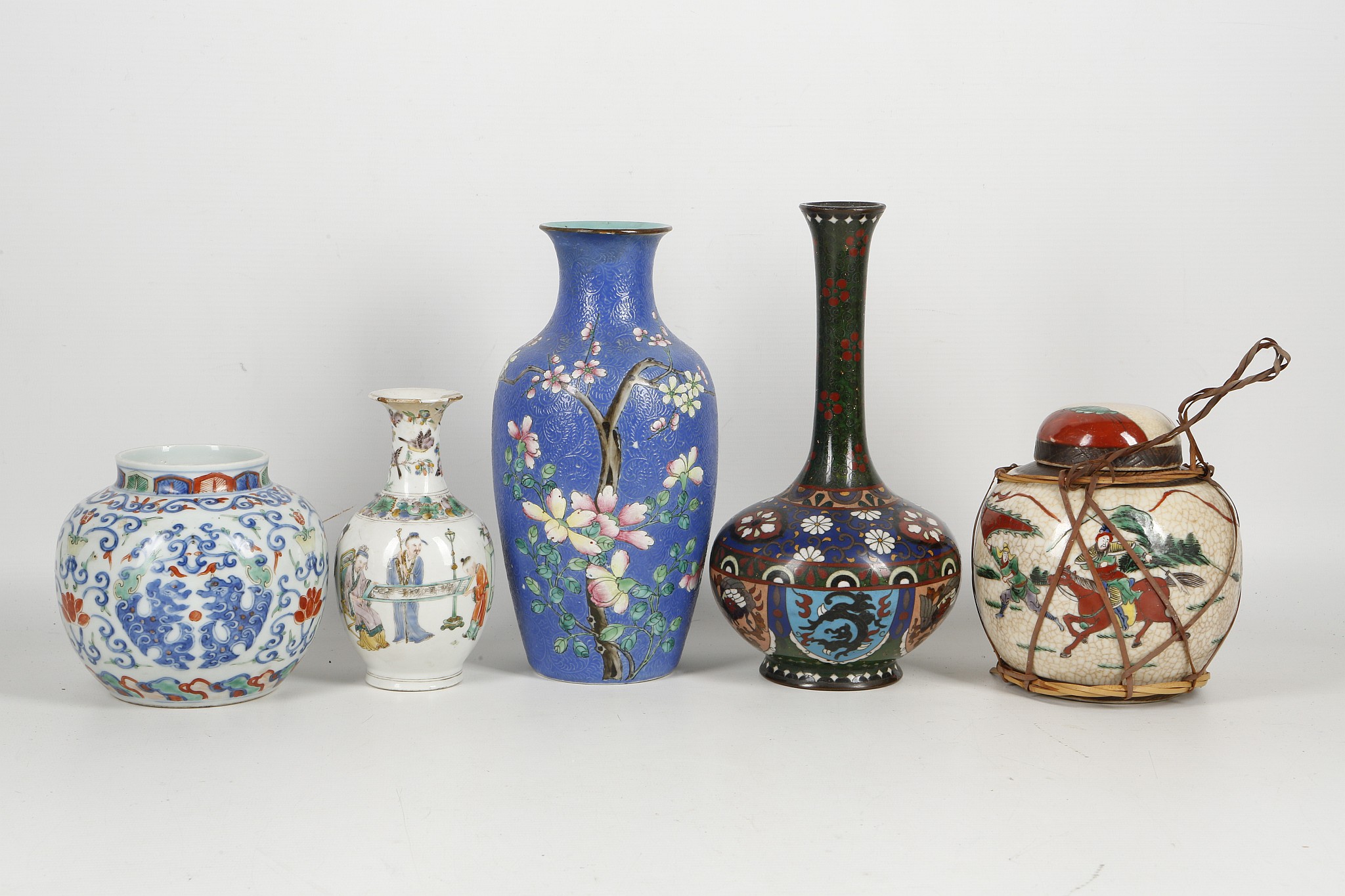 WITHDRAWN! A collection of Chinese and Japanese vases, comprising a Qing dynasty famille rose vase