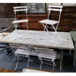 Upcycled garden table and chairs; plank top on cast shaped legs, folding slat chairs all with a
