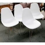 A set of four Eames inspired white Eiffel Tower chairs, 83 H x 47 W x 55cm deep.