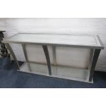 A modern console table by Jameson Furniture, with distressed silvered mirror top and bottom and