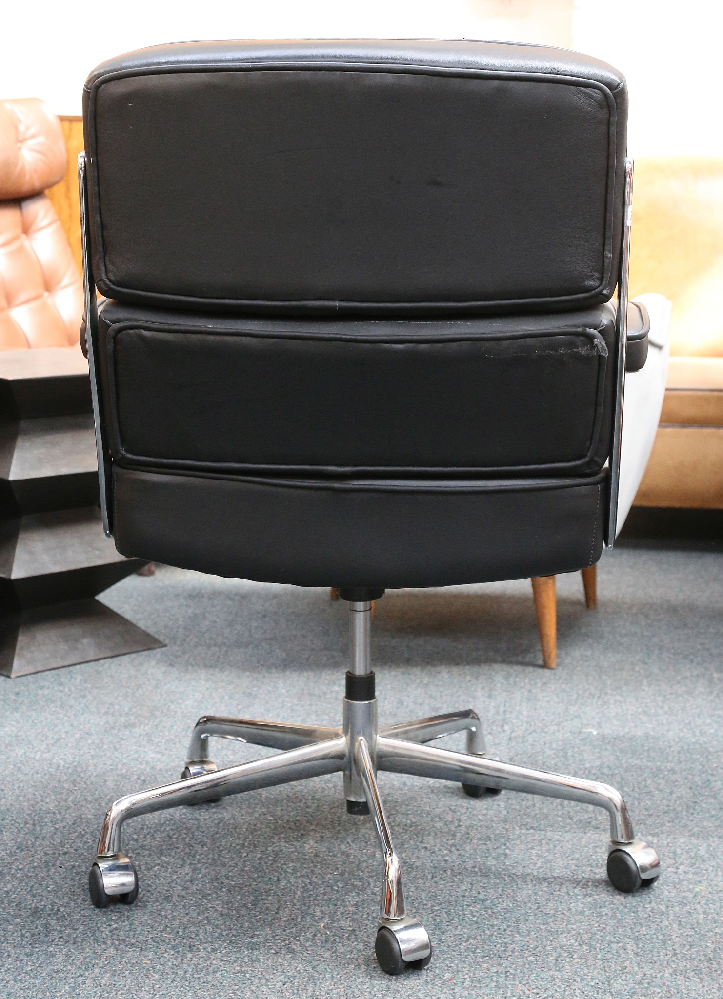 An Eames style, Time Life lobby chair in black leather and chrome with rise and fall action. - Image 2 of 2