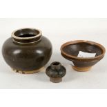 A collection of three South East Asian, lead glazed ceramics, comprising a bowl with chocolate brown