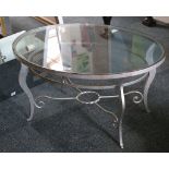 A 20th century cast iron and glass oval shaped top coffee table, 90cm diameter.