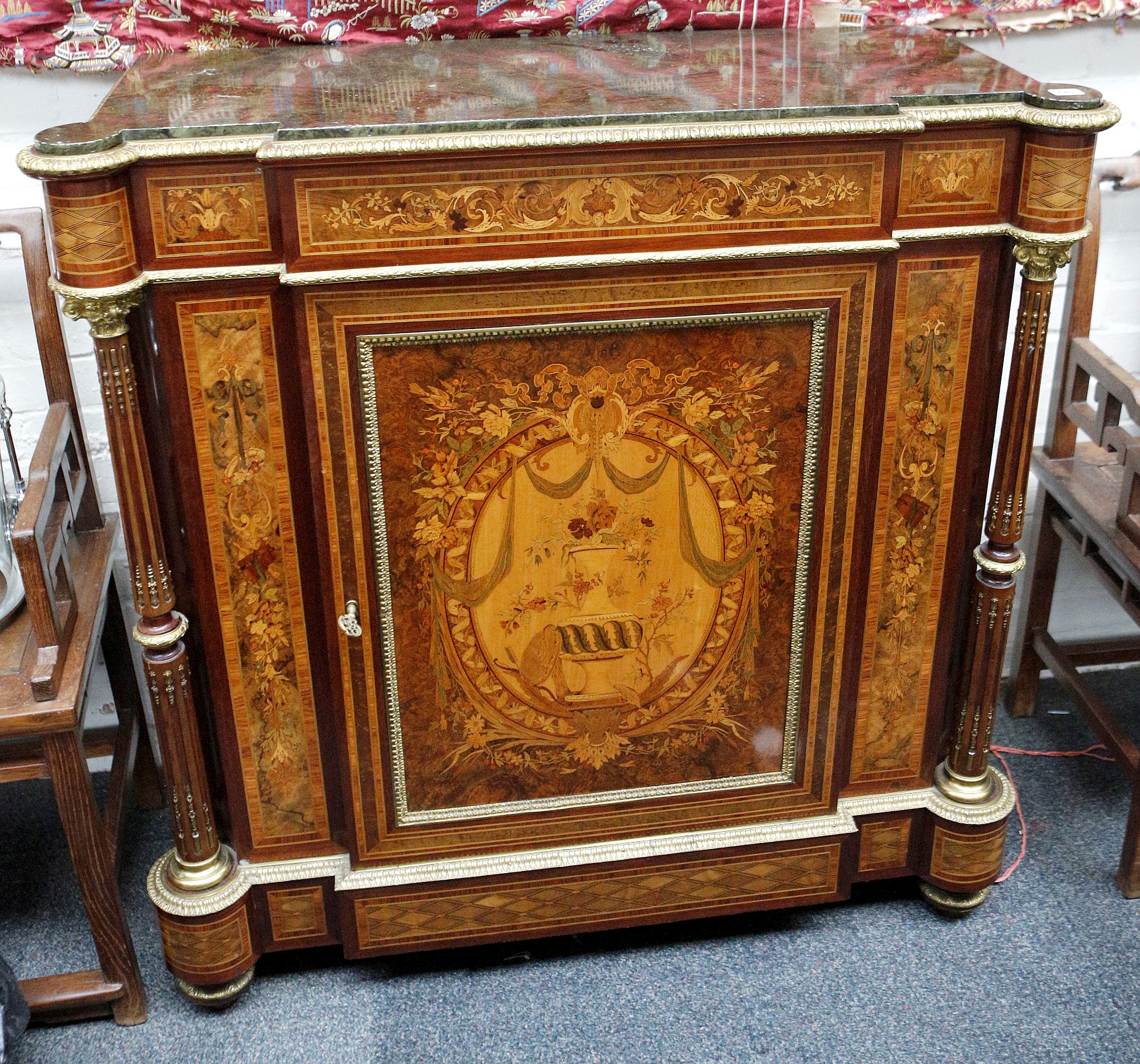 A fine 19th century ormolu mounted, marble topped pier cabinet, the front and sides profusely