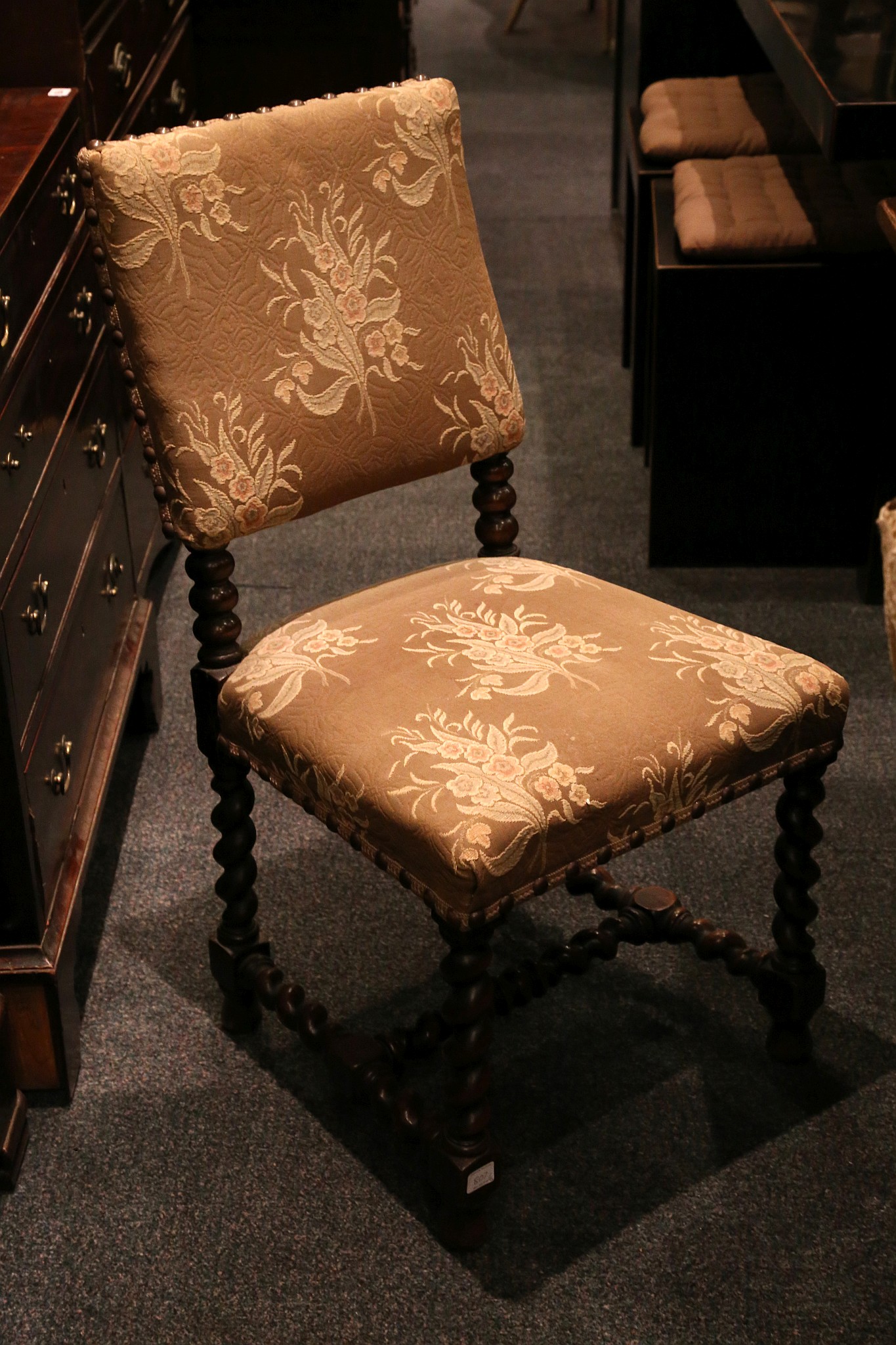 A set of six Victorian walnut dining chairs in Carolean style, with upholstered seats and backs