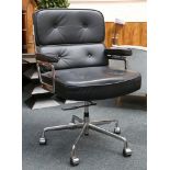 An Eames style, Time Life lobby chair in black leather and chrome with rise and fall action.