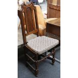 A Victorian solid seat hall chair, oak, sculpted back with solid splat, solid seat, turned and bar