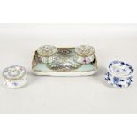 A 19th century Meissen porcelain pair of inkwells on matching trays, pale turquoise ground with