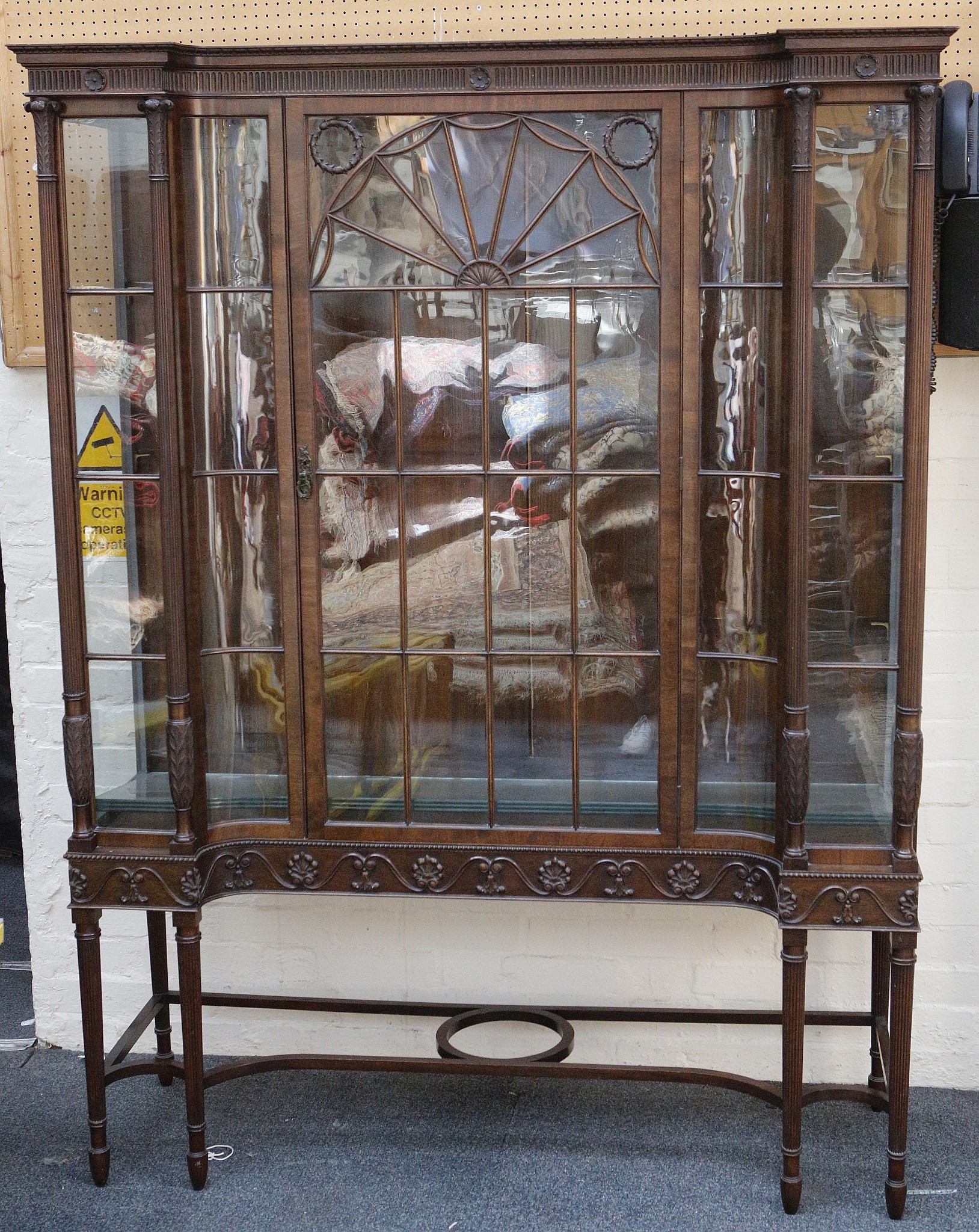 An Adam's style, early 20th century, 'D' shape display cabinet, tab carved trim over reeded band