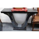 A modern console table, with black mirrored glass top, on 'U' shaped support, 117.5 x 31.5cm.