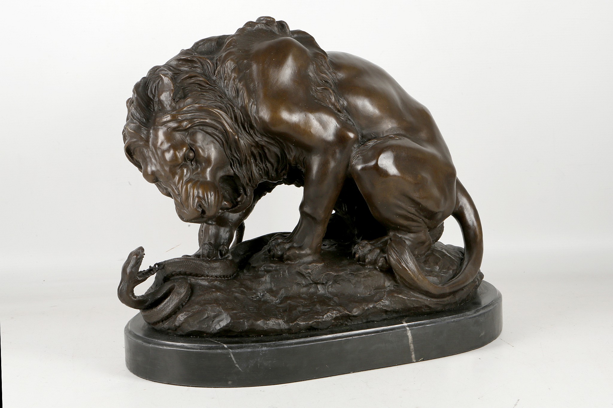 After A. L. Barye, bronze sculpture, study of a lion battling a snake, 30 x 40cm.