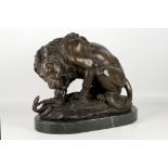 After A. L. Barye, bronze sculpture, study of a lion battling a snake, 30 x 40cm.