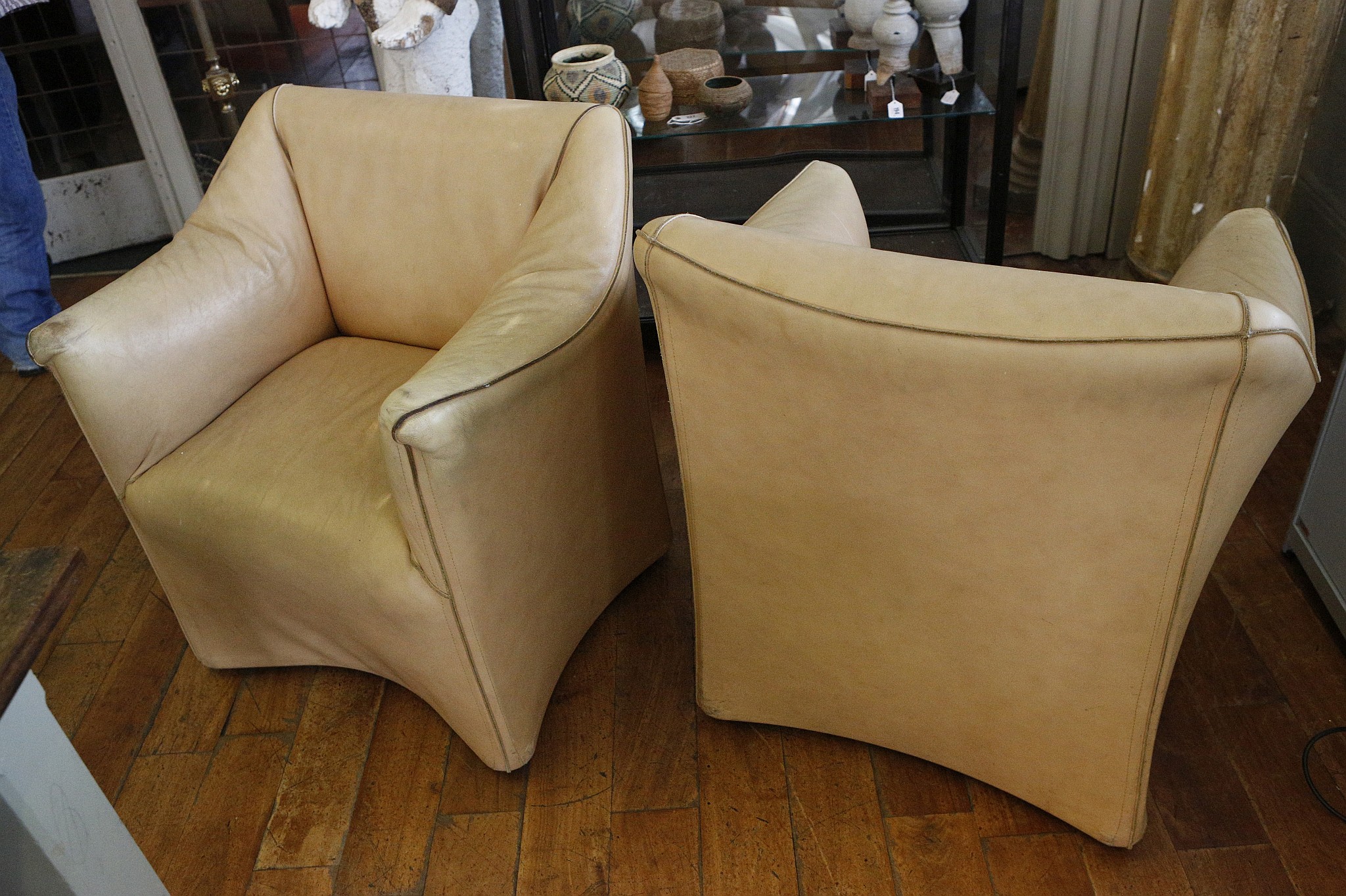 A pair of French leather contemporary box tub chairs, c.1980.