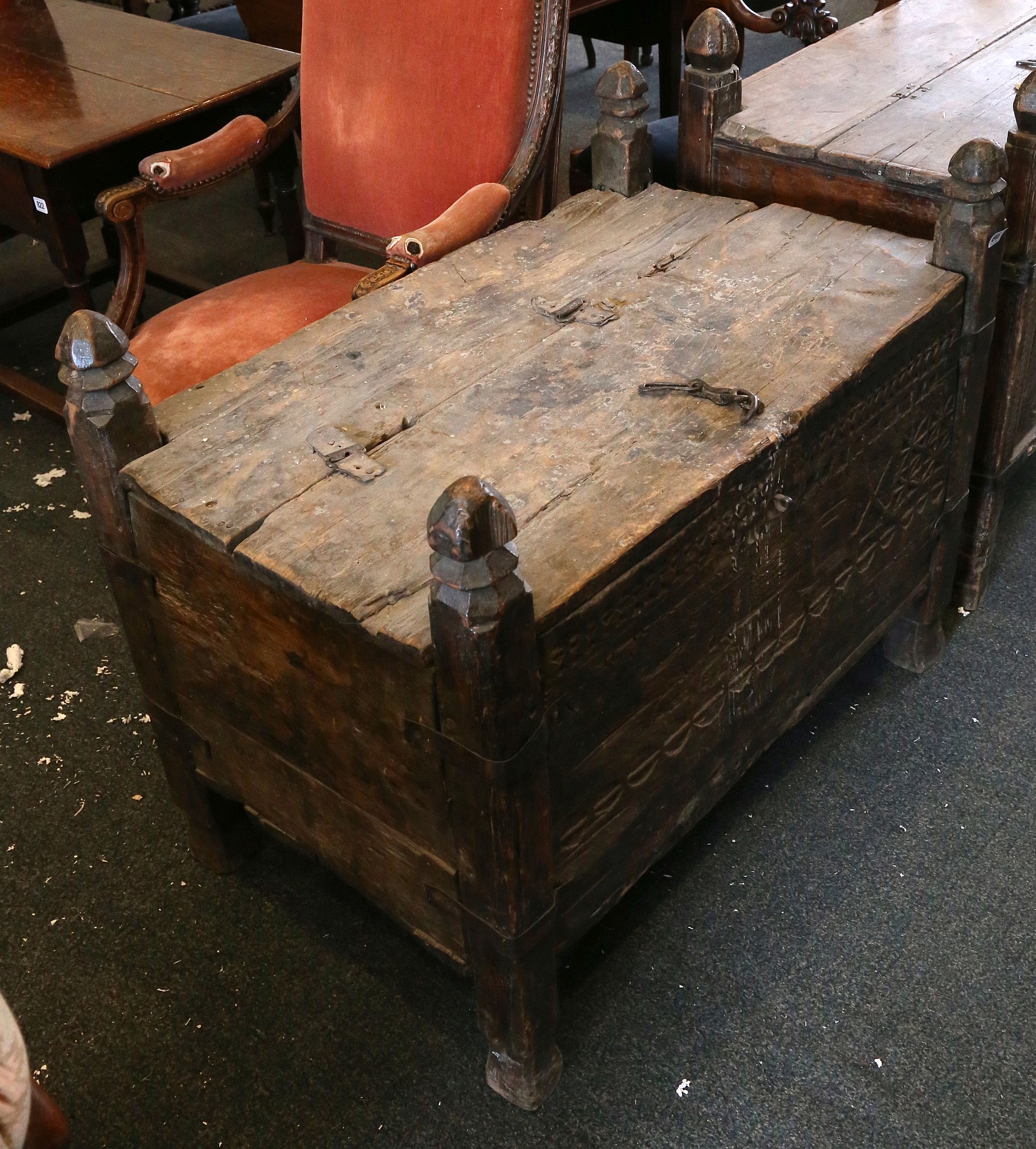 An Eastern carved softwood chest, late 19th century. The divided hinged lid above an entwined - Image 2 of 2