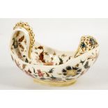 A late 19th century, Hungarian Zsolnay earthenware boat shaped bowl, painted with Iznik style flower