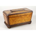 A large Victorian two colour sarcophagus form tea caddy, having satin birch panels and mahogany edge