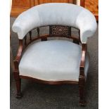 A 19th century, mahogany library chair having turned spindle back, teal upholstery, raised on