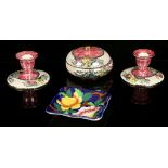 A pair of Art Deco Mailing Pottery of Newcastle on Tyne, lustre dwarf candlesticks with tulips and