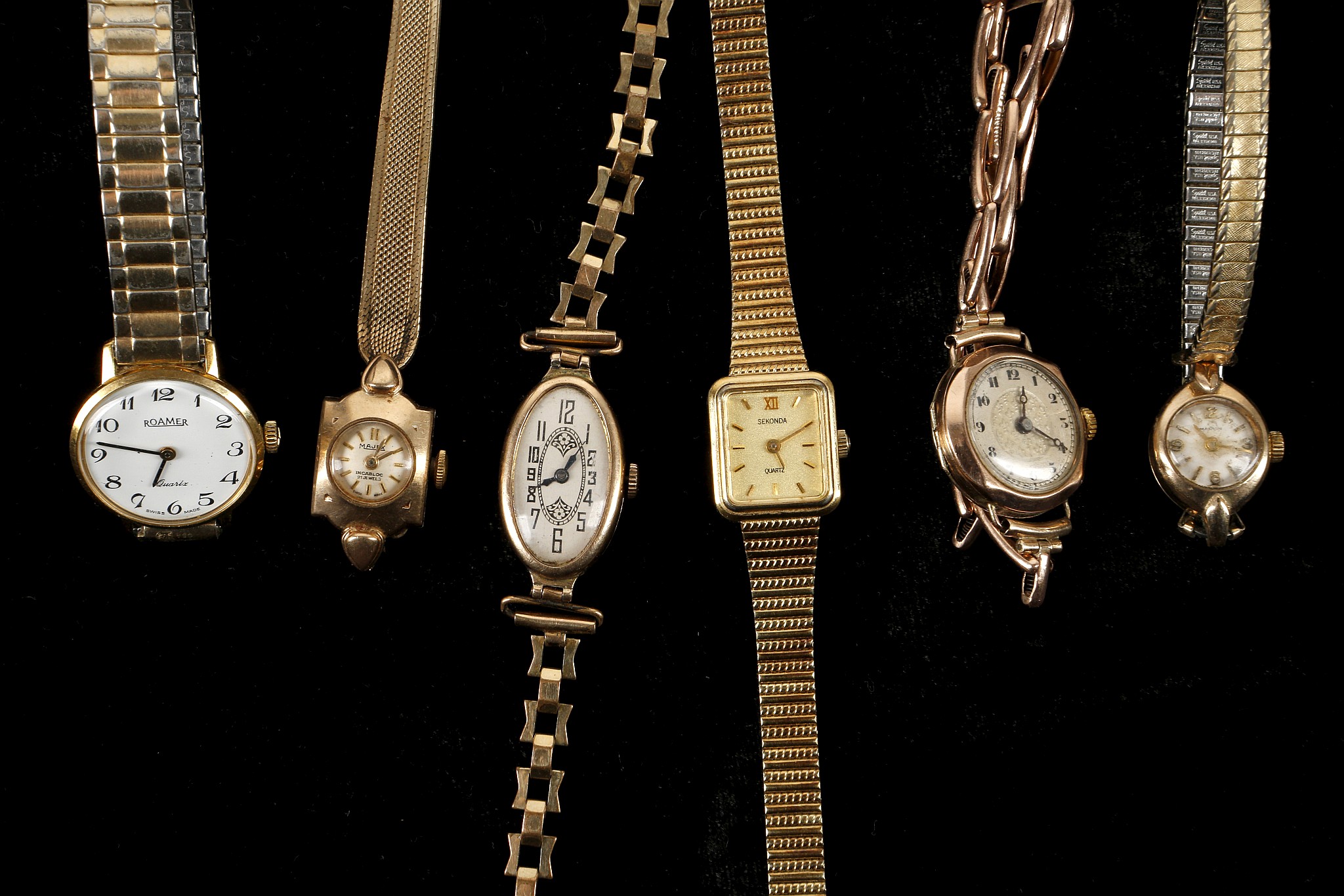 Four various vintage 9ct gold cased ladies wristwatches, to include an oval cased dress watch, a